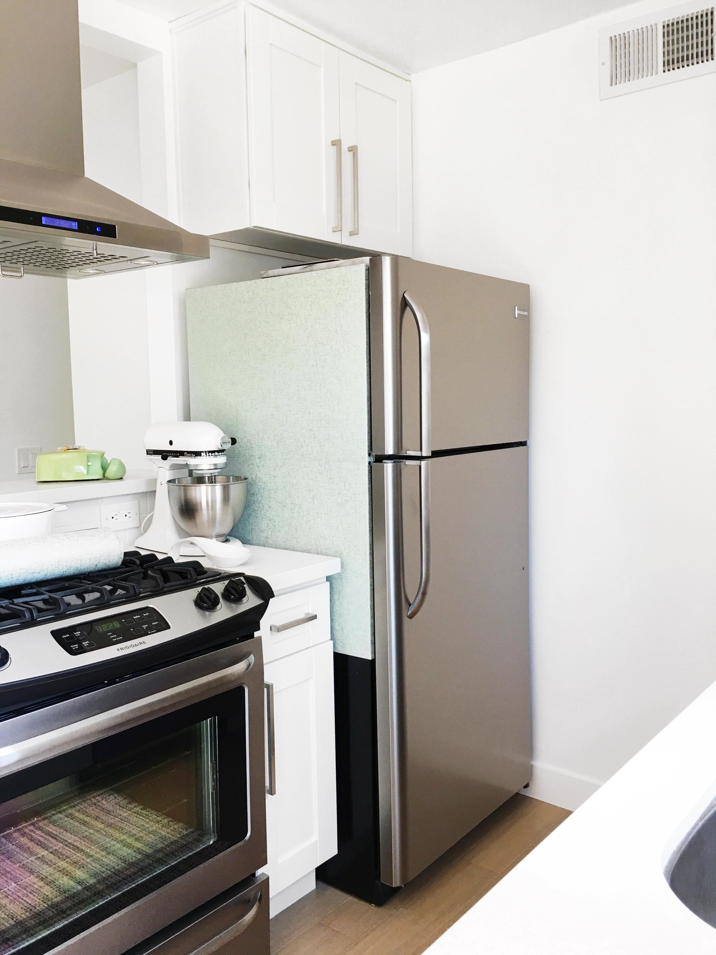 Use peel and stick wallpaper to cover a refrigerator (1)