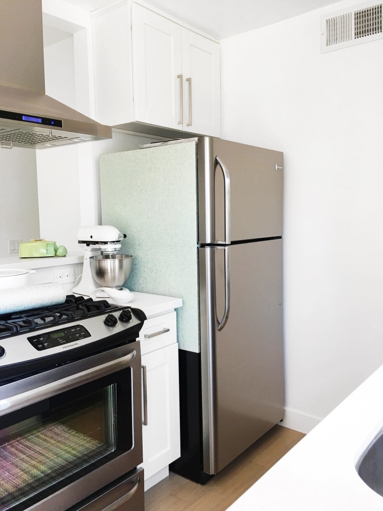 Use peel and stick wallpaper to cover a refrigerator (1)