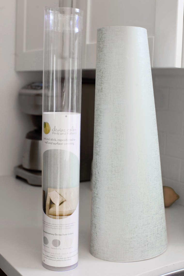 Use peel and stick wallpaper to cover a refrigerator