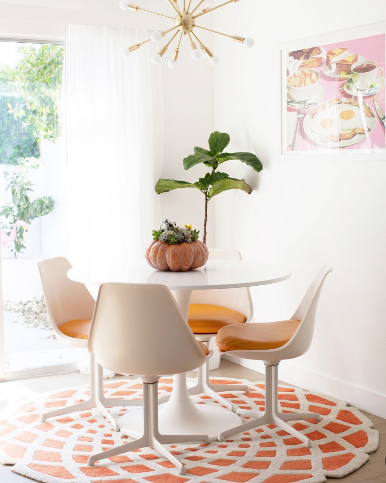 Pumpkin used as succulent planter for centerpiece